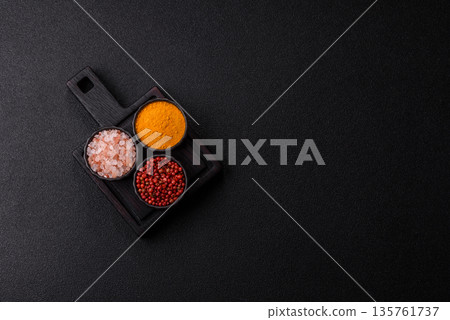 Indian spices, pepper, salt, turmeric, ingredients for cooking. Spices pepper, salt, and turmeric 135761737