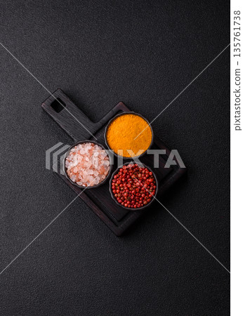 Indian spices, pepper, salt, turmeric, ingredients for cooking. Spices pepper, salt, and turmeric Indian spices, pepper, salt, turmeric, ingredients for cooking. Spices pepper, salt, and turmeric 135761738