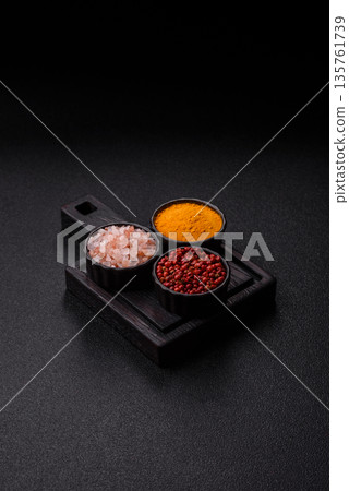 Indian spices, pepper, salt, turmeric, ingredients for cooking. Spices pepper, salt, and turmeric Indian spices, pepper, salt, turmeric, ingredients for cooking. Spices pepper, salt, and turmeric 135761739