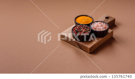 Indian spices, pepper, salt, turmeric, ingredients for cooking. Spices pepper, salt, and turmeric 135761740