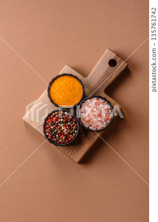 Indian spices, pepper, salt, turmeric, ingredients for cooking. Spices pepper, salt, and turmeric 135761742