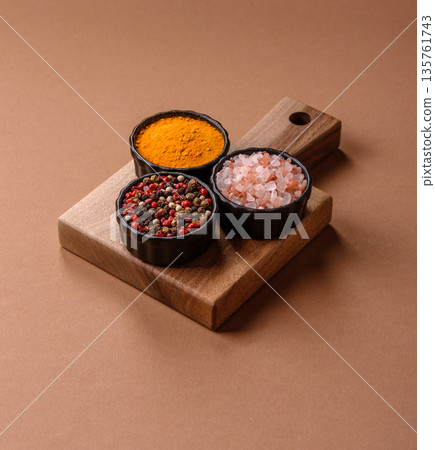 Indian spices, pepper, salt, turmeric, ingredients for cooking. Spices pepper, salt, and turmeric Indian spices, pepper, salt, turmeric, ingredients for cooking. Spices pepper, salt, and turmeric 135761743