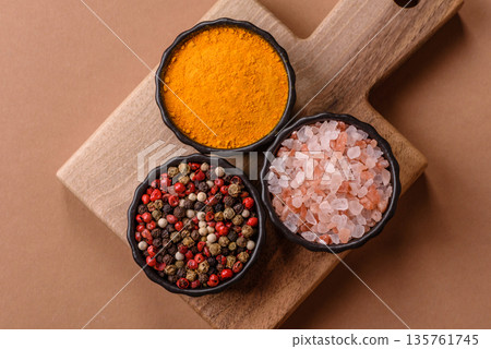 Indian spices, pepper, salt, turmeric, ingredients for cooking. Spices pepper, salt, and turmeric Indian spices, pepper, salt, turmeric, ingredients for cooking. Spices pepper, salt, and turmeric 135761745