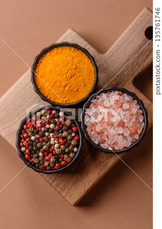 Indian spices, pepper, salt, turmeric, ingredients for cooking. Spices pepper, salt, and turmeric Indian spices, pepper, salt, turmeric, ingredients for cooking. Spices pepper, salt, and turmeric 135761746