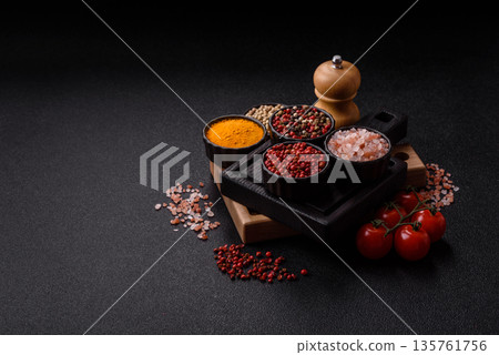 Indian spices, pepper, salt, turmeric, ingredients for cooking. Spices pepper, salt, and turmeric Indian spices, pepper, salt, turmeric, ingredients for cooking. Spices pepper, salt, and turmeric 135761756