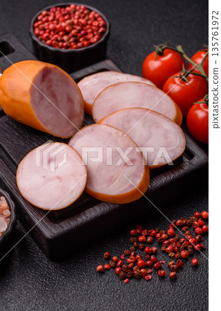 Ham, cooked sausage slices for breakfast sandwiches. Sliced boiled sausage 135761972