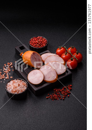 Ham, cooked sausage slices for breakfast sandwiches. Sliced boiled sausage Ham, cooked sausage slices for breakfast sandwiches. Sliced boiled sausage 135761977