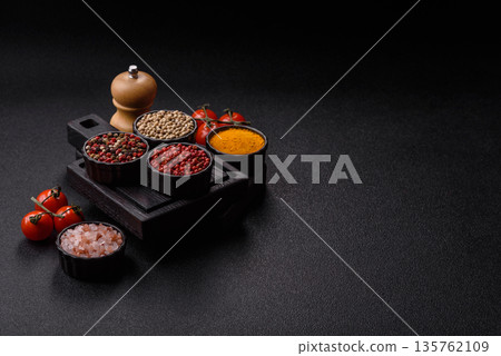 Indian spices, pepper, salt, turmeric, ingredients for cooking. Spices pepper, salt, and turmeric Indian spices, pepper, salt, turmeric, ingredients for cooking. Spices pepper, salt, and turmeric 135762109