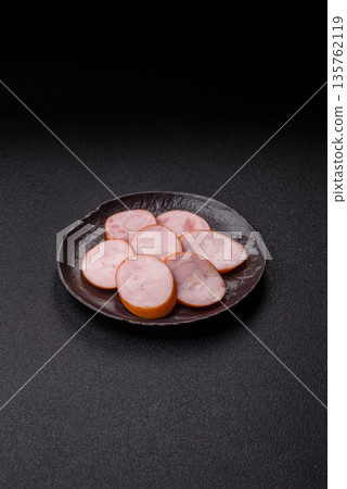 Ham, cooked sausage slices for breakfast sandwiches. Sliced boiled sausage Ham, cooked sausage slices for breakfast sandwiches. Sliced boiled sausage 135762119
