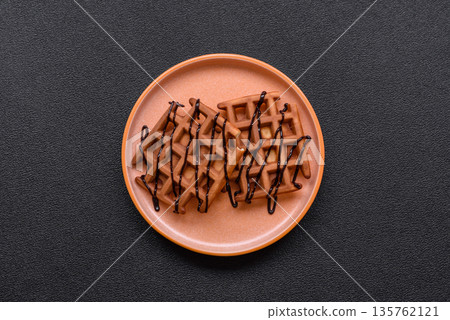 Belgian waffles, a healthy sweet breakfast dessert, food background. Belgian waffles Belgian waffles, a healthy sweet breakfast dessert, food background. Belgian waffles 135762121