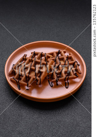 Belgian waffles, a healthy sweet breakfast dessert, food background. Belgian waffles Belgian waffles, a healthy sweet breakfast dessert, food background. Belgian waffles 135762123