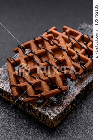 Belgian waffles, a healthy sweet breakfast dessert, food background. Belgian waffles 135762135