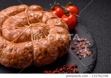 Grilled sausage in the shape of a spiral or snail, from chicken or pork. Spiral or snail sausage Grilled sausage in the shape of a spiral or snail, from chicken or pork. Spiral or snail sausage 135762396