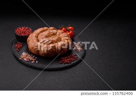 Grilled sausage in the shape of a spiral or snail, from chicken or pork. Spiral or snail sausage Grilled sausage in the shape of a spiral or snail, from chicken or pork. Spiral or snail sausage 135762400
