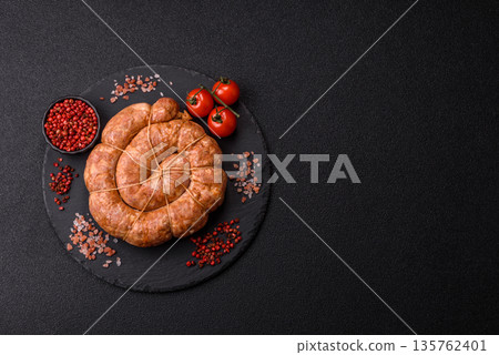 Grilled sausage in the shape of a spiral or snail, from chicken or pork. Spiral or snail sausage Grilled sausage in the shape of a spiral or snail, from chicken or pork. Spiral or snail sausage 135762401