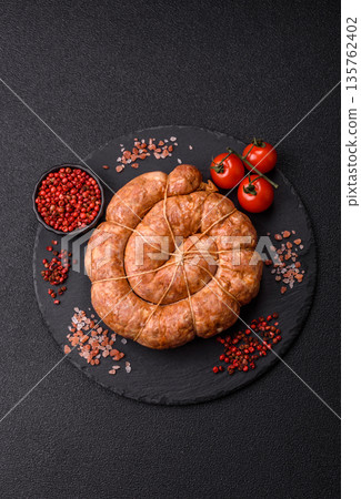 Grilled sausage in the shape of a spiral or snail, from chicken or pork. Spiral or snail sausage Grilled sausage in the shape of a spiral or snail, from chicken or pork. Spiral or snail sausage 135762402