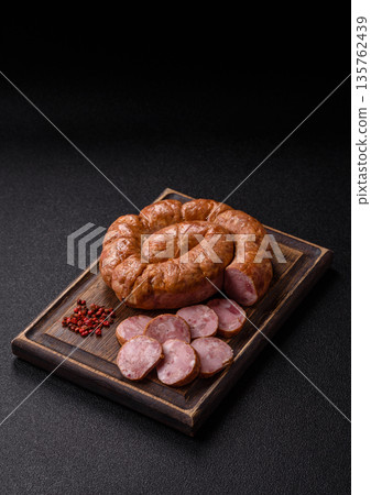 Grilled sausage in the shape of a spiral or snail, from chicken or pork. Spiral or snail sausage Grilled sausage in the shape of a spiral or snail, from chicken or pork. Spiral or snail sausage 135762439