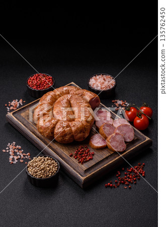 Grilled sausage in the shape of a spiral or snail, from chicken or pork. Spiral or snail sausage Grilled sausage in the shape of a spiral or snail, from chicken or pork. Spiral or snail sausage 135762450
