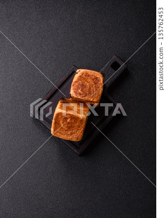 A French cube croissant with chocolate filling, a sweet breakfast pastry. Cube croissant A French cube croissant with chocolate filling, a sweet breakfast pastry. Cube croissant 135762453