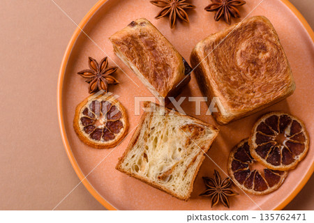 A French cube croissant with chocolate filling, a sweet breakfast pastry. Cube croissant A French cube croissant with chocolate filling, a sweet breakfast pastry. Cube croissant 135762471
