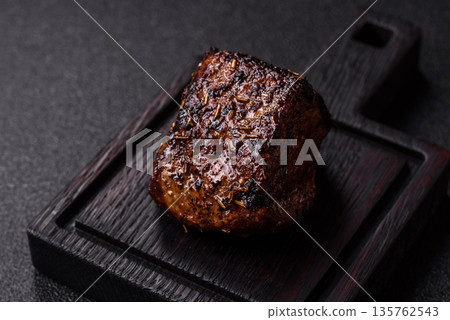 Grilled or barbecued beef steak, a fillet of meat cooked for dinner. Beef steak Grilled or barbecued beef steak, a fillet of meat cooked for dinner. Beef steak 135762543
