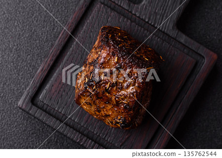Grilled or barbecued beef steak, a fillet of meat cooked for dinner. Beef steak Grilled or barbecued beef steak, a fillet of meat cooked for dinner. Beef steak 135762544