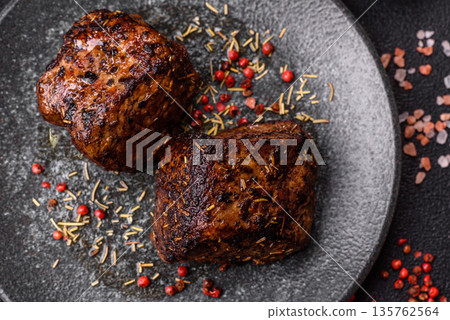 Grilled or barbecued beef steak, a fillet of meat cooked for dinner. Beef steak 135762564