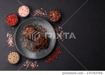 Grilled or barbecued beef steak, a fillet of meat cooked for dinner. Beef steak 135762568