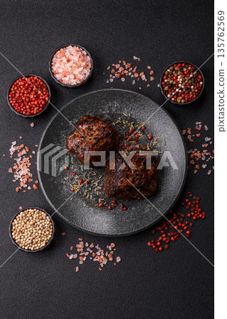 Grilled or barbecued beef steak, a fillet of meat cooked for dinner. Beef steak 135762569