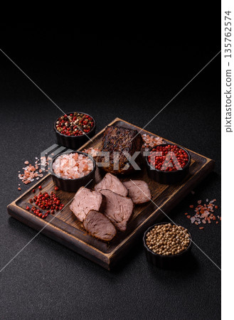 Grilled or barbecued beef steak, a fillet of meat cooked for dinner. Beef steak 135762574