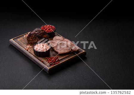 Grilled or barbecued beef steak, a fillet of meat cooked for dinner. Beef steak 135762582