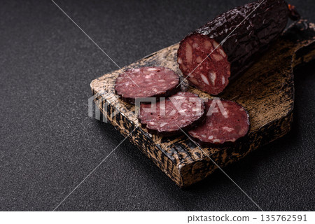 Black blood pudding, grilled pork sausage cooked for dinner. Blood pudding Black blood pudding, grilled pork sausage cooked for dinner. Blood pudding 135762591