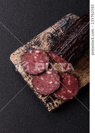 Black blood pudding, grilled pork sausage cooked for dinner. Blood pudding Black blood pudding, grilled pork sausage cooked for dinner. Blood pudding 135762593