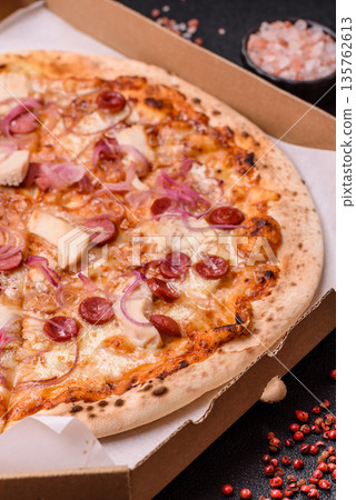 Italian pizza with sausage, chicken, and cheese for dinner. Sausage pizza 135762613