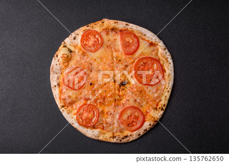 Vegetarian Margherita pizza with tomato, cheese, and sauce, for dinner. Margherita pizza Vegetarian Margherita pizza with tomato, cheese, and sauce, for dinner. Margherita pizza 135762650