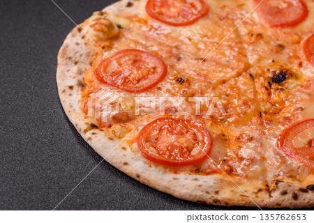 Vegetarian Margherita pizza with tomato, cheese, and sauce, for dinner. Margherita pizza Vegetarian Margherita pizza with tomato, cheese, and sauce, for dinner. Margherita pizza 135762653