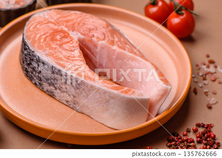 Fish, raw salmon steak, fresh seafood for grilling with salt, spices, and herbs. Raw salmon steak 135762666