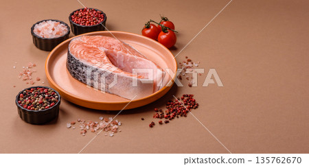 Fish, raw salmon steak, fresh seafood for grilling with salt, spices, and herbs. Raw salmon steak 135762670