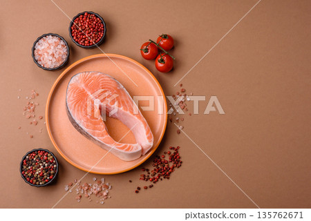 Fish, raw salmon steak, fresh seafood for grilling with salt, spices, and herbs. Raw salmon steak 135762671
