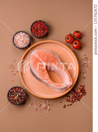 Fish, raw salmon steak, fresh seafood for grilling with salt, spices, and herbs. Raw salmon steak 135762672