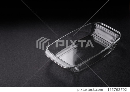 A rectangular transparent glass tray for baking and cooking at home. The glass tray A rectangular transparent glass tray for baking and cooking at home. The glass tray 135762792
