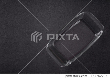 A rectangular transparent glass tray for baking and cooking at home. The glass tray A rectangular transparent glass tray for baking and cooking at home. The glass tray 135762793