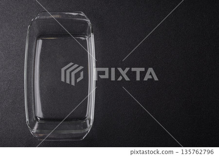 A rectangular transparent glass tray for baking and cooking at home. The glass tray A rectangular transparent glass tray for baking and cooking at home. The glass tray 135762796