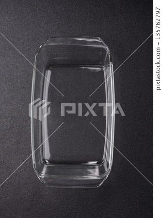 A rectangular transparent glass tray for baking and cooking at home. The glass tray 135762797