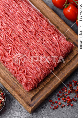 Raw ground beef or pork for burgers or meatballs with salt and spices. Raw ground beef Raw ground beef or pork for burgers or meatballs with salt and spices. Raw ground beef 135762859