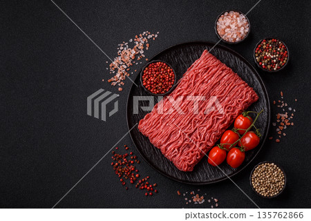 Raw ground beef or pork for burgers or meatballs with salt and spices. Raw ground beef 135762866