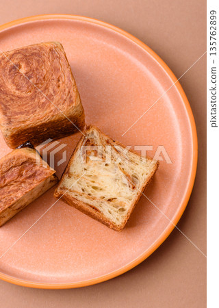 A French cube croissant with chocolate filling, a sweet breakfast pastry. Cube croissant 135762899