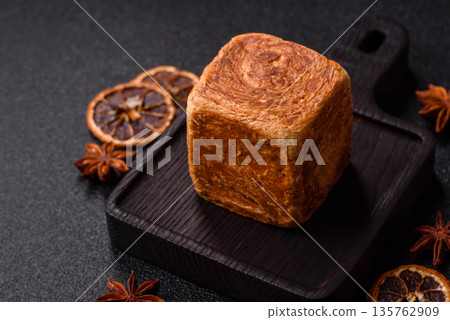 A French cube croissant with chocolate filling, a sweet breakfast pastry. Cube croissant A French cube croissant with chocolate filling, a sweet breakfast pastry. Cube croissant 135762909