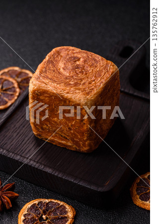 A French cube croissant with chocolate filling, a sweet breakfast pastry. Cube croissant A French cube croissant with chocolate filling, a sweet breakfast pastry. Cube croissant 135762912