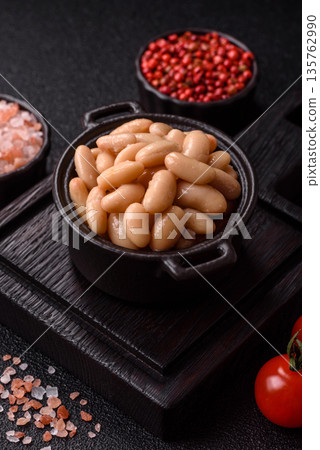 Canned white beans, prepared as an ingredient for a classic English breakfast. Canned beans Canned white beans, prepared as an ingredient for a classic English breakfast. Canned beans 135762990